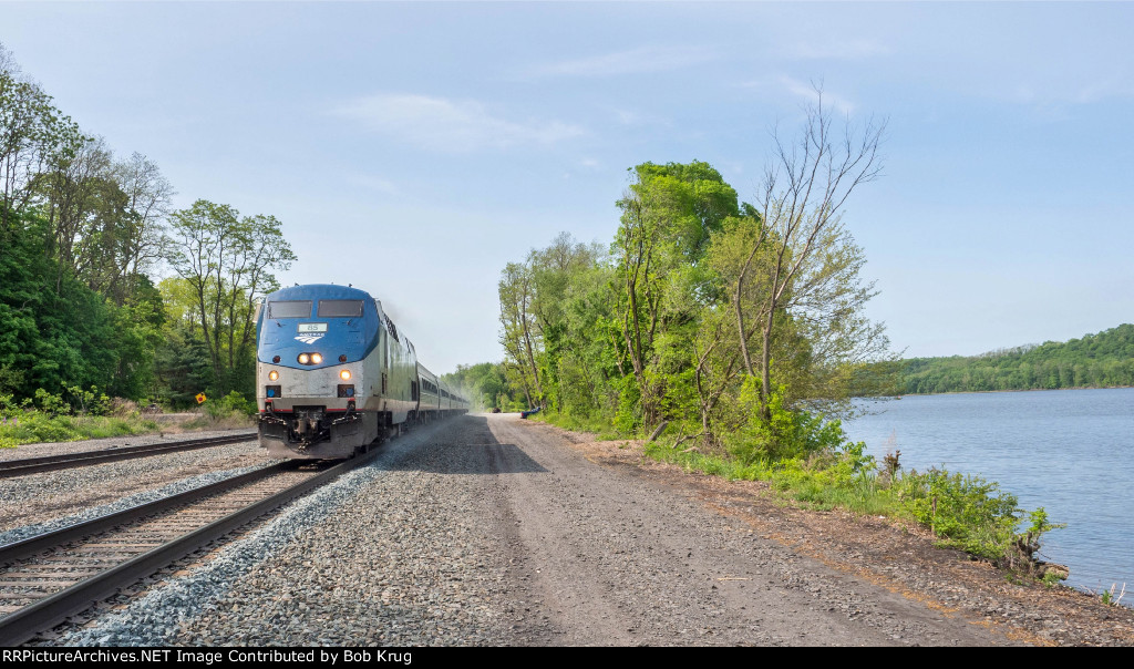 AMTK 85 at the head of The Maple Leaf  heading up the Hudson River at Stuyvesant, NY